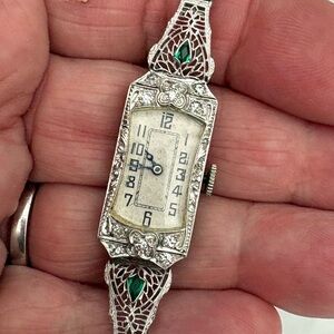 Stunning 1920s platinum and gold watch with diamonds and emeralds